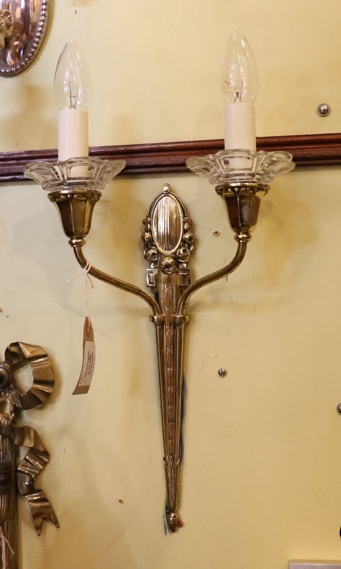 A pair of 1930s French silver brass and glass twin branch wall lights, height 41cm to top of bulb holders, width 26cm